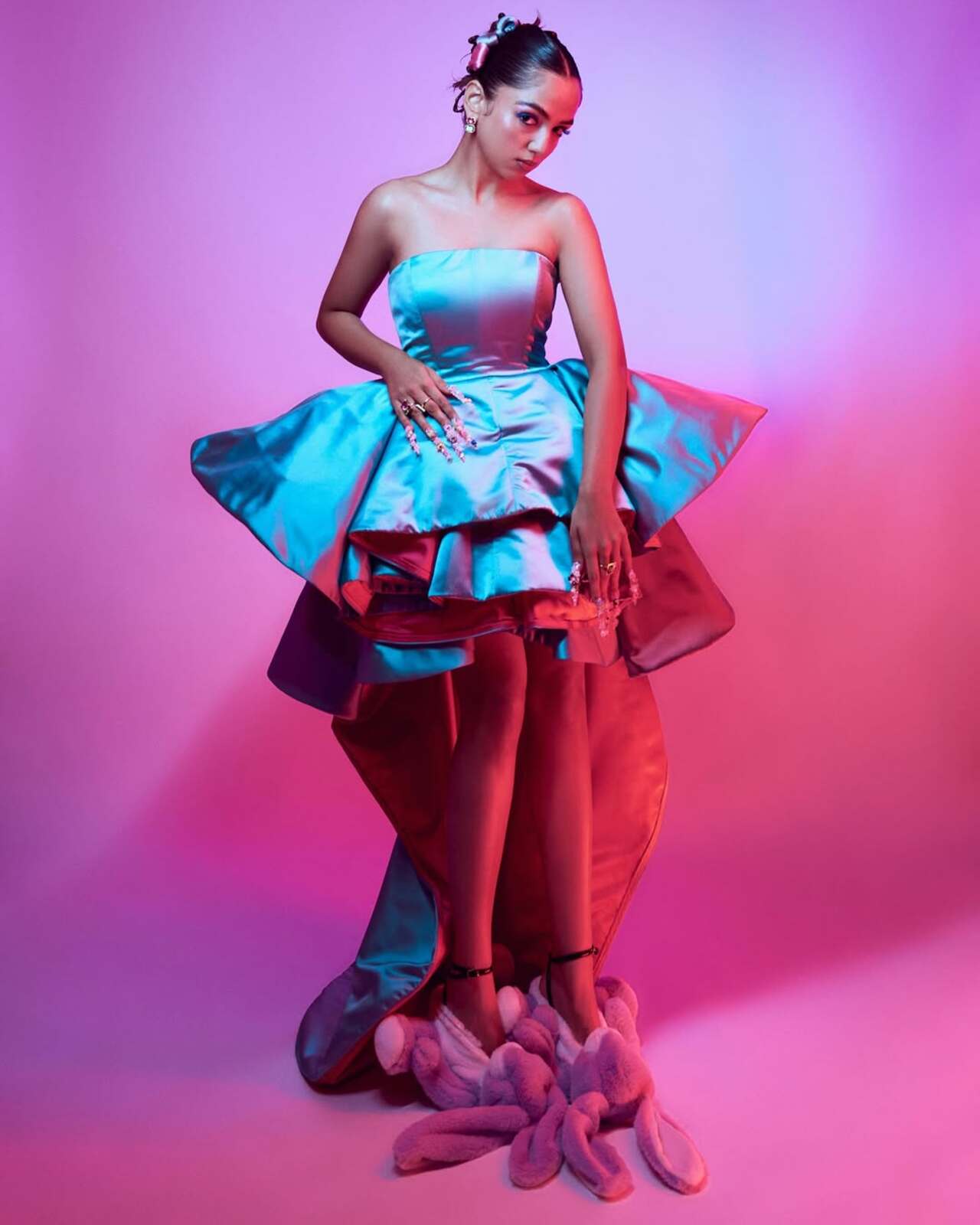 Ahsaas kept her fashion game way ahead by donning a blue outfit with pink undertones. Her ensemble boasted a pleated structural design and a floor-sweeping trail.